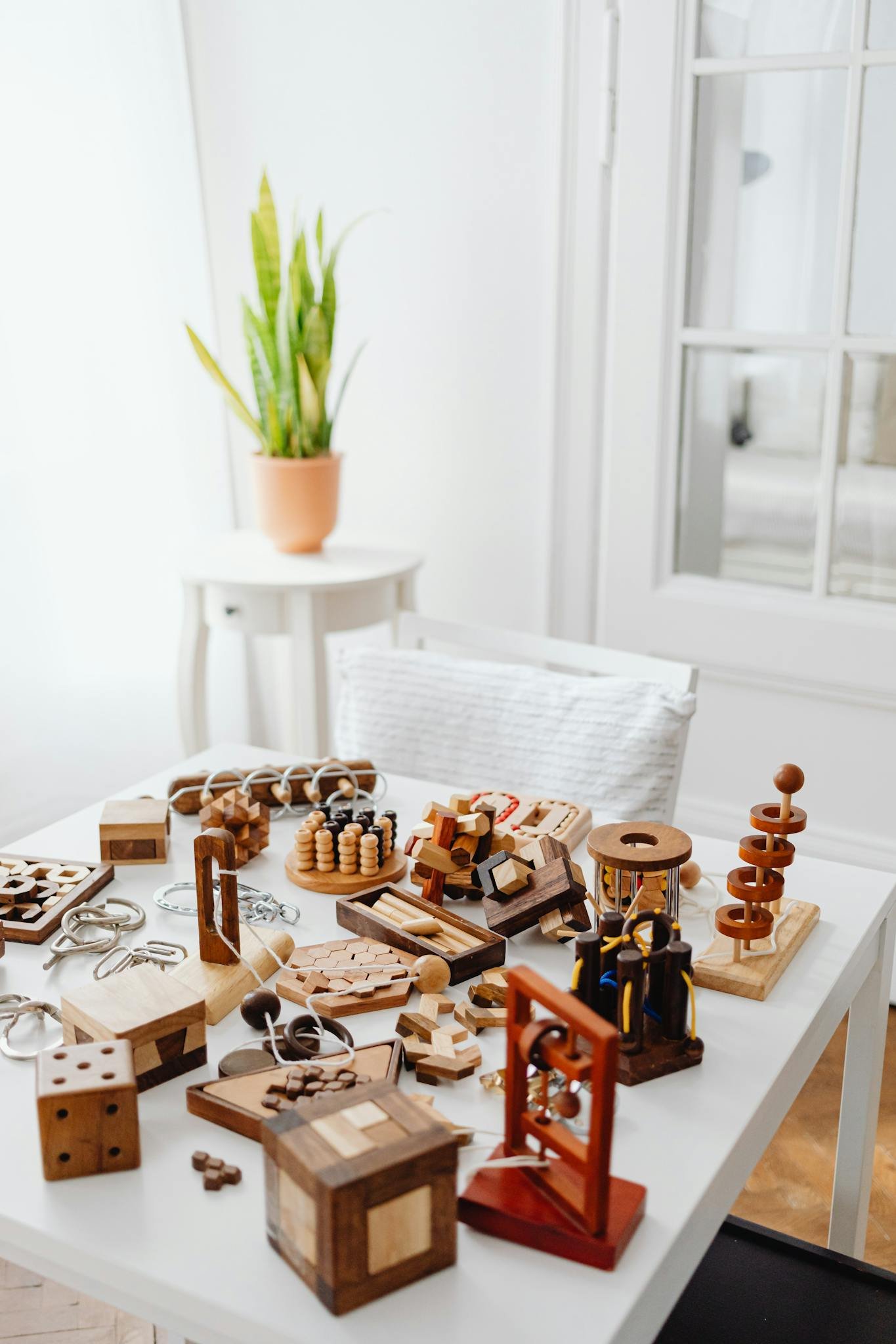 Explore a variety of wooden puzzles on a table, perfect for brain training and decor.